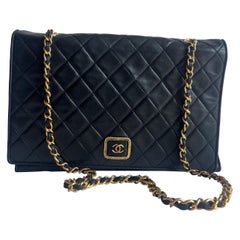 Chanel Vintage Flapbag With Gold Logo Closure Black Lambskin Leather