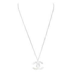 CHANEL 09A silver toned green resin reversible crystal pave CC pendent necklace