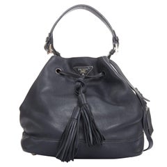 PRADA City Calf Bucket black calfskin leather triangle tassel drawstring bag