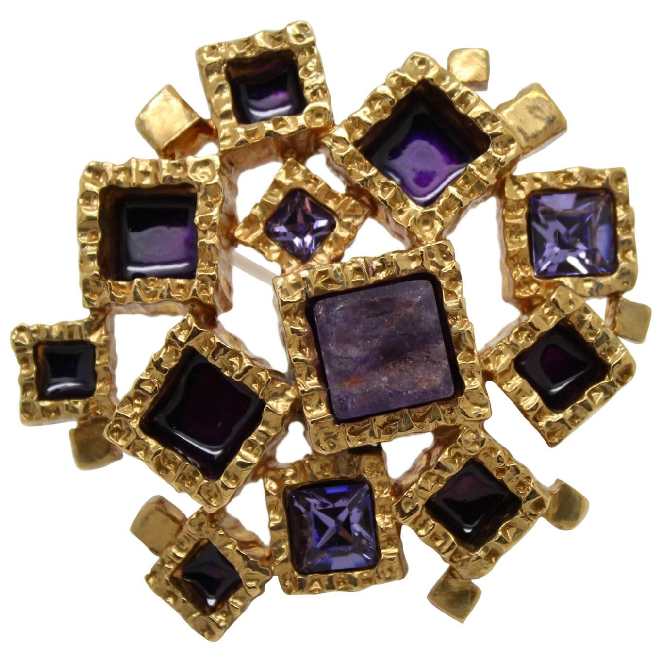 Awesome Yves Saint Laurent Golden Brooch with purple stones For Sale