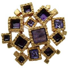 Awesome Yves Saint Laurent Golden Brooch with purple stones