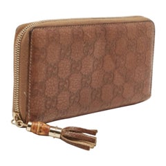 Gucci Portefeuille zippé en cuir de bambou Guccissima marron