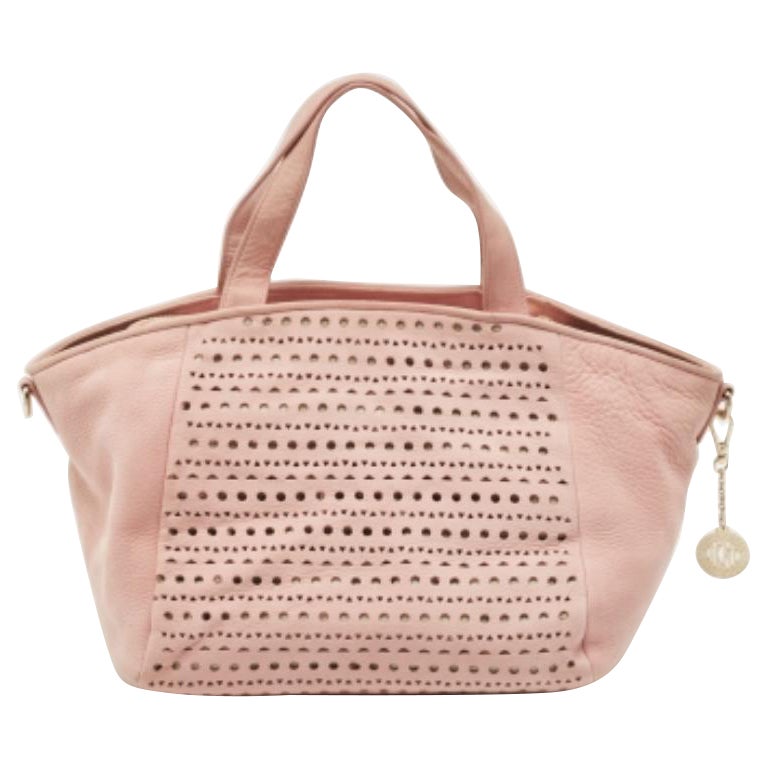 Tote DKNY de nobuk perforado rosa