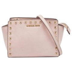 Michael Michael Kors - Borsa a tracolla media Selma con borchie in pelle rosa