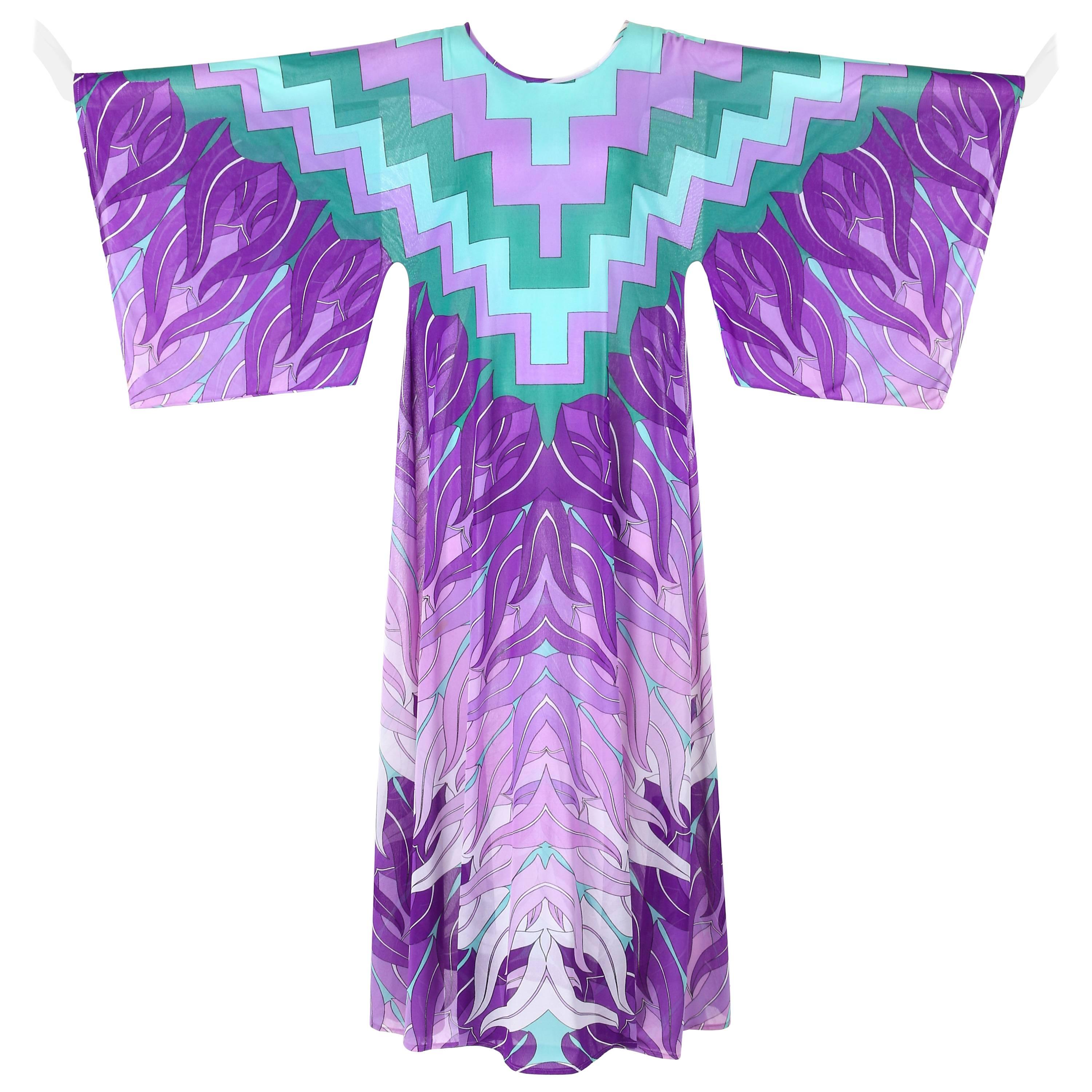 Vintage Gottex c.1970's chiffon kimono maxi dress / beach cover. Geometric print in shades of purple and green goes from neckline to waist and changes into a botanical leaf print at sleeves and down to hemline. Scoop neckline. Kimono sleeves.