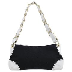 Chanel é003 Shoulder Bag in White Leather and Black Canvas.