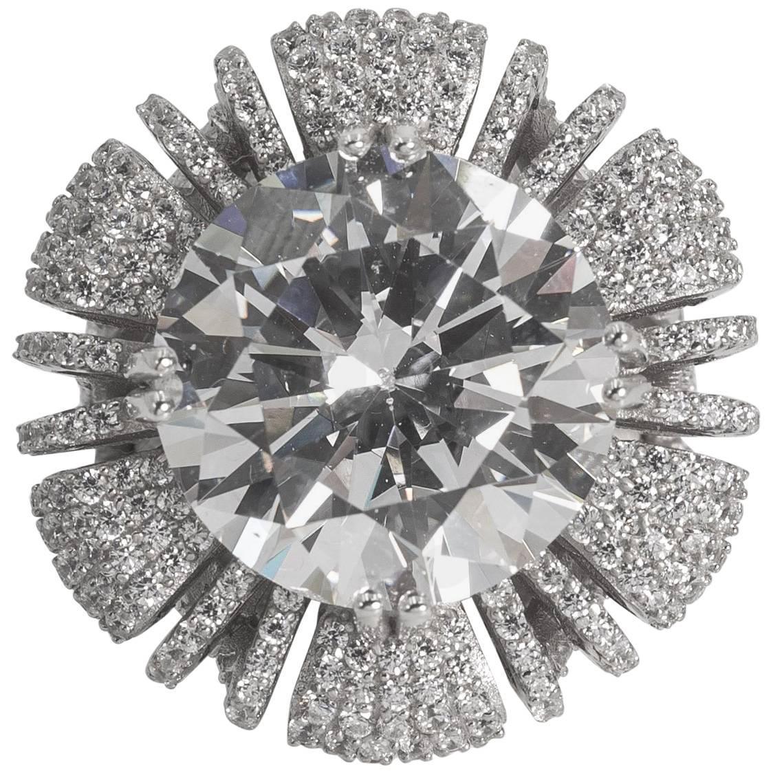 A 15 carat hand special cut round sharp white cubic zirconia nestled on a cushion pave white faux diamonds set in sterling designed to the highest fine standards possible. A classic amazing sparkly and brilliant look that will last forever. Any size