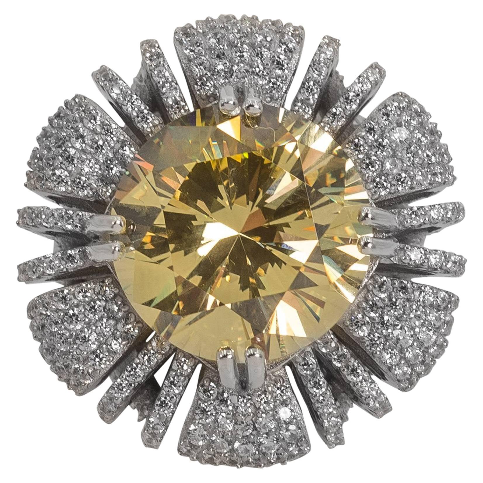 A 15 carat hand special cut round fancy canary yellow cubic zirconia nestled on a cushion pave white faux diamonds set in sterling designed to the highest fine standards possible. A classic amazing sparkly and brilliant look that will last forever.