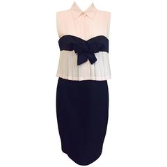 The crown jewel of Haute Couture Chanel, this classic two tone dress with bow
