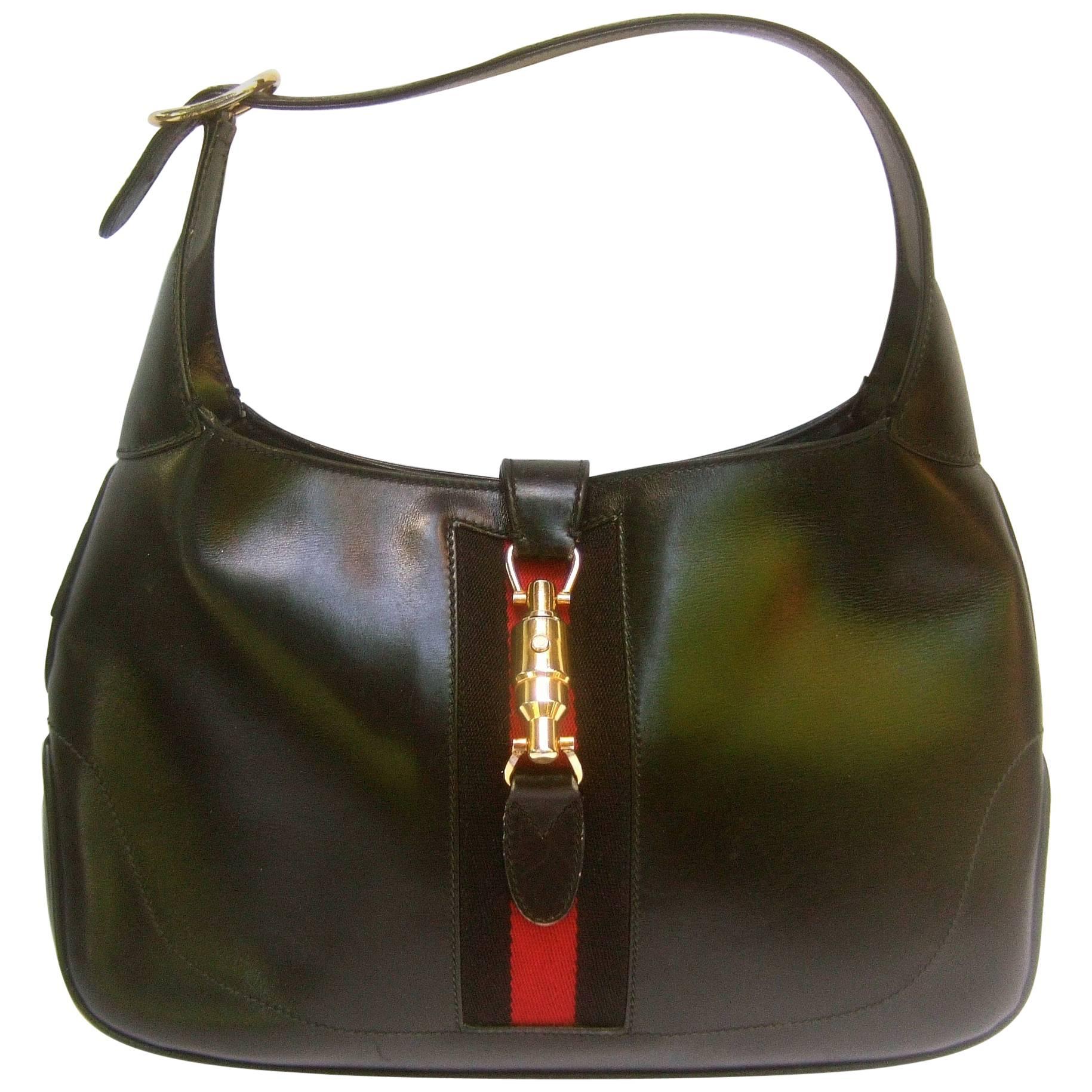 Gucci Italy Iconic Black Leather Piston Jackie O Handbag ca 1970s