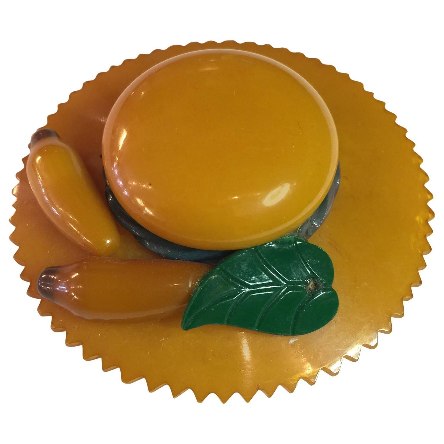 1930s Butterscotch Bakelite Figural Hat Brooch/Pin with Figural Bananas Detail For Sale