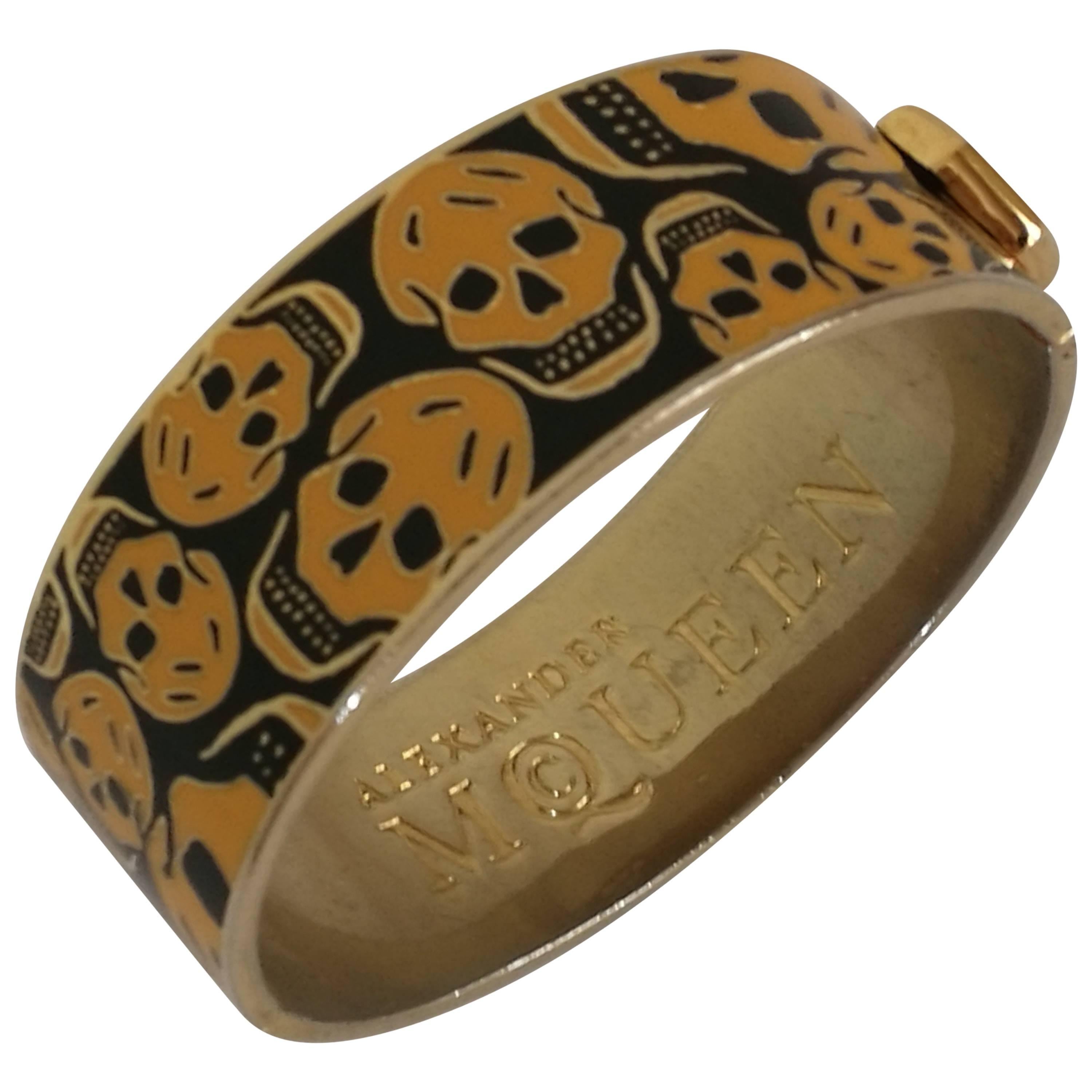 Alexander McQueen Gold tone Skulls black Bracelet