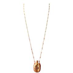 Vintage Gucci golden perfume bottle necklace with logo mark on top. Rare jewelry