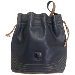 Vintage Celine navy and brown leather hobo bucket shoulder bag with drawstrings.