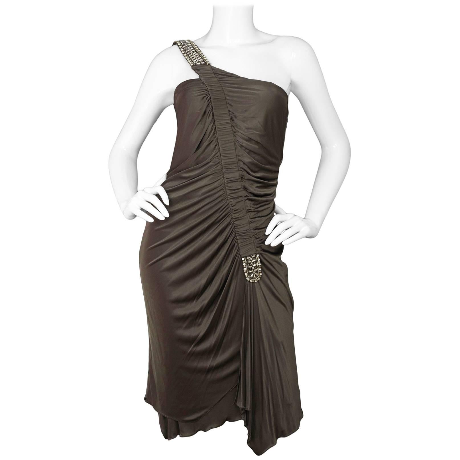 Roberto Cavalli Bronze Ruched One Shoulder Dress 
Features embellishments on one shoulder strap

Color: Bronze
Composition: Not given- believed to be a nylon/elastane-blend
Lining: Bronze Nylon-blend
Closure/Opening: Back zip up closure
Exterior