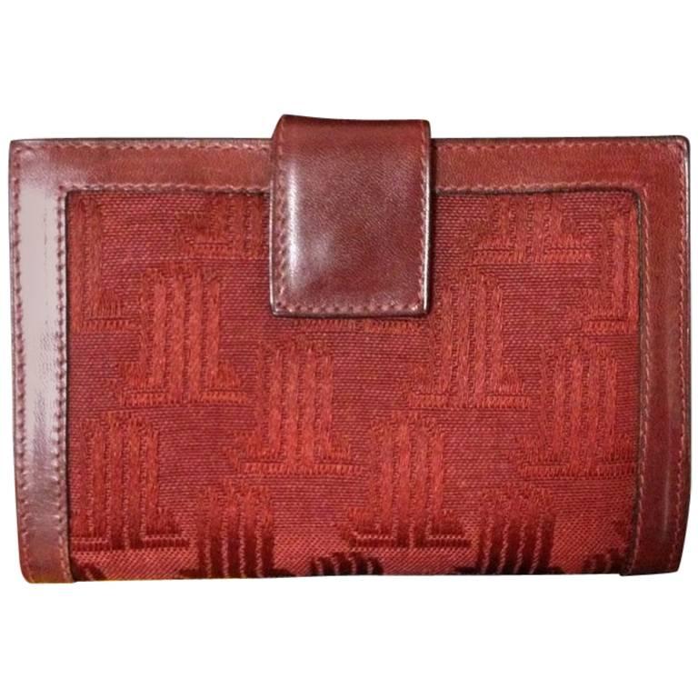 Vintage LANVIN wine logo jacquard and leather wallet with kiss lock coin room. 