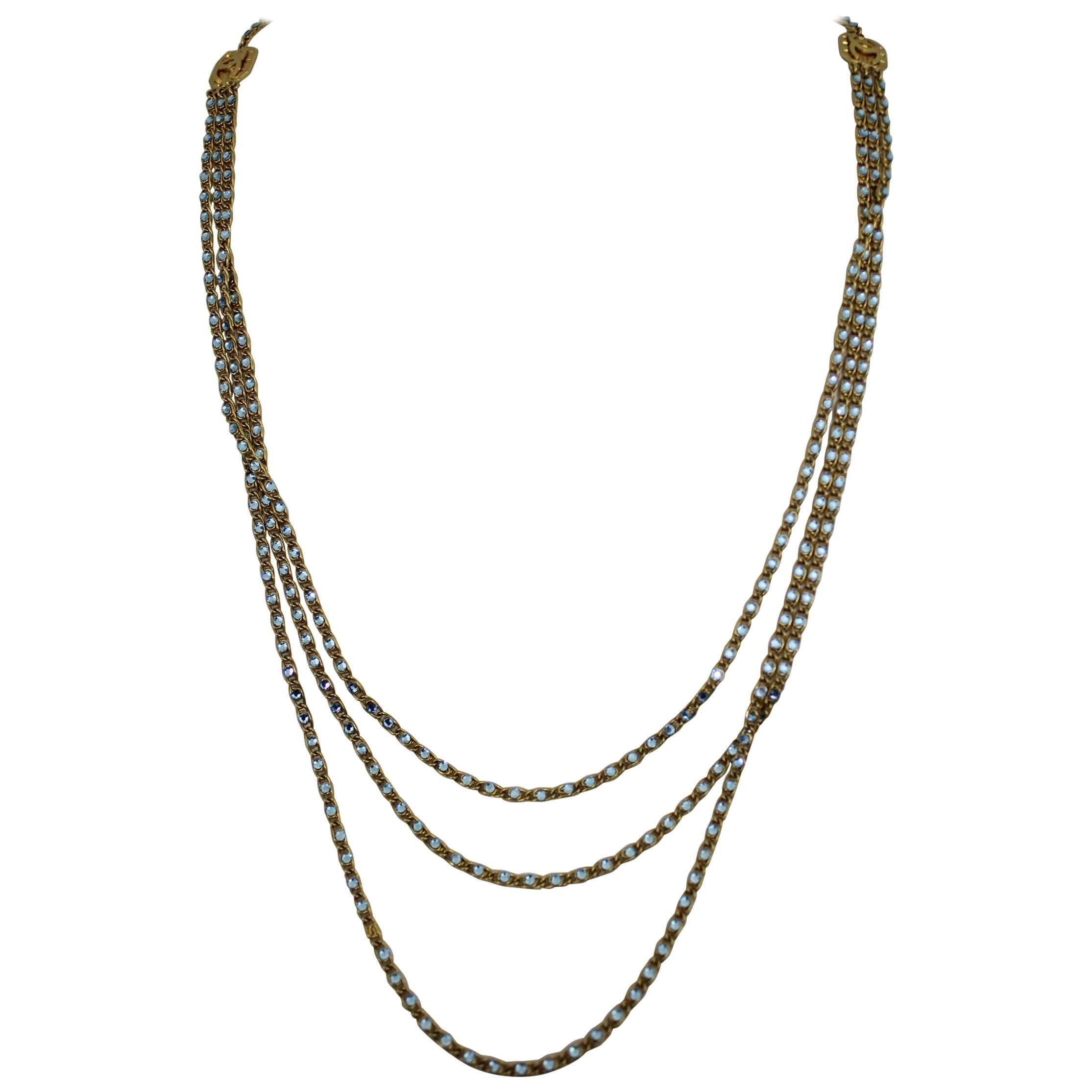 Sophisticated 1997 Chanel Necklace with blue stones and gold plated metal.