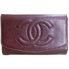 Vintage CHANEL brown caviar leather wallet with large CC stitch mark. Classic.