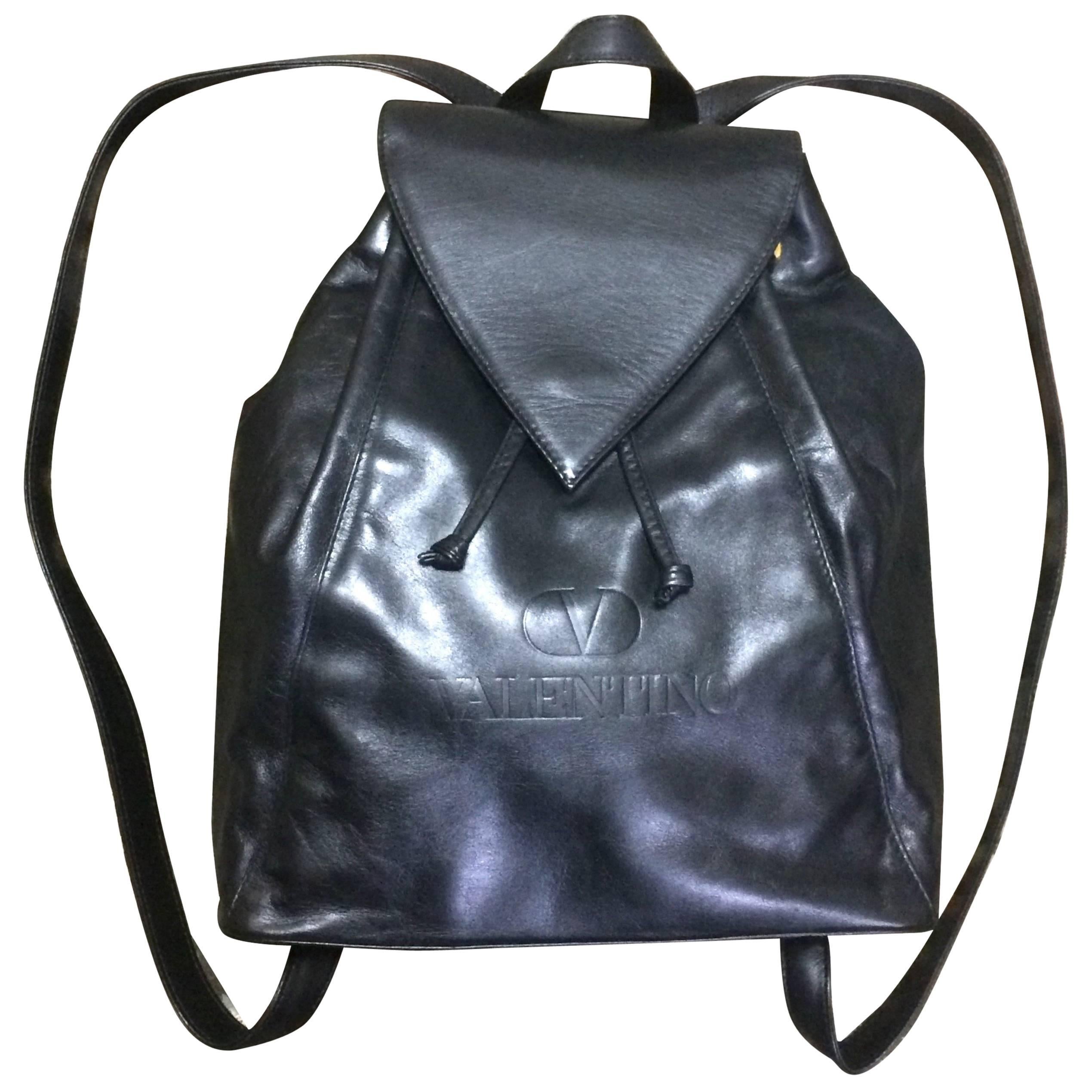 Vintage Valentino black nappa leather backpack with embossed logo. Classic bag.