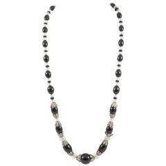 Elegant black glass and paste graduated necklace, French, 1920s at 1stDibs