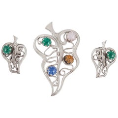 Schiaparelli Rhodium plated and art glass brooch and earring set, 1950s