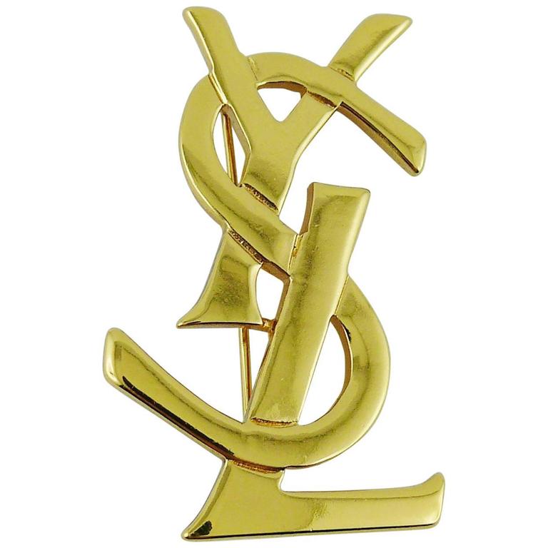 Yves Saint Laurent YSL Gold Toned Logo Brooch For Sale at 1stdibs