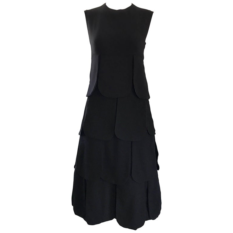 60s black dress fashion Unique Vintage Plus Size 1960s Black Criss Cross Halter Penelope Wiggle Dress main image 1