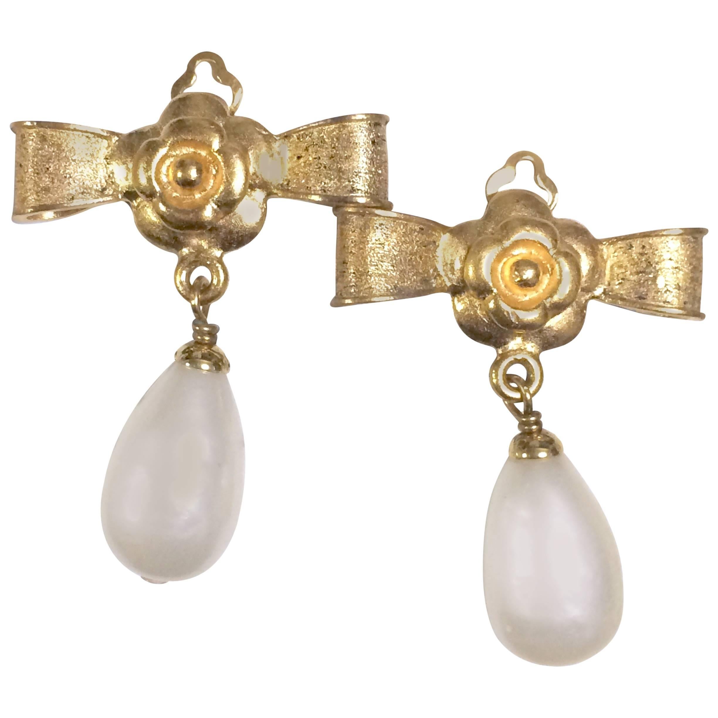 Vintage CHANEL golden bow and camellia motif and dangling white teardrop earring For Sale