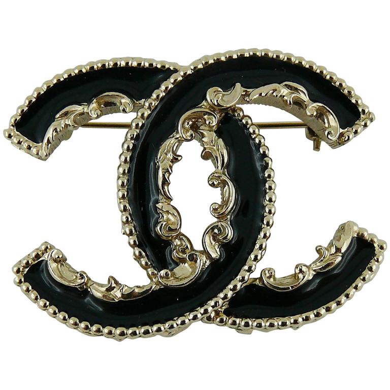 Chanel Black Enamel Baroque Logo Brooch at 1stDibs | chanel baroque ...