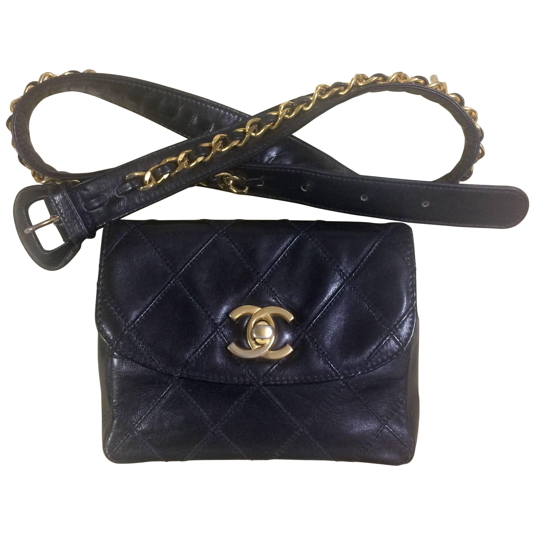 Vintage CHANEL black leather 2.55 waist purse, fanny bag with golden chain belt.
