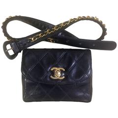 Retro CHANEL black leather 2.55 waist purse, fanny bag with golden chain belt.