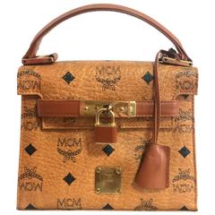 Vintage MCM classic brown mini kelly bag with key, designed by