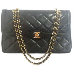 Vintage Chanel black 2.55 shoulder bag with gold, silver CC. Paris Limited Edit.