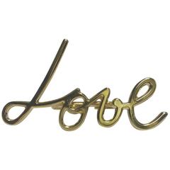 Bague iconique LANVIN "Love" Taille 51 pour deux doigts en métal doré