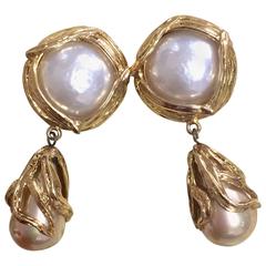 Vintage Yves Saint Laurent arabesque dangling earrings with large faux pearls.