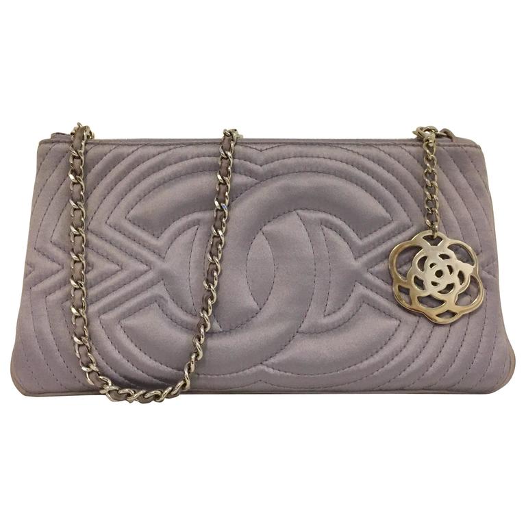 Charming Chanel Small Satin Lavender Clutch with Metal Charm For Sale
