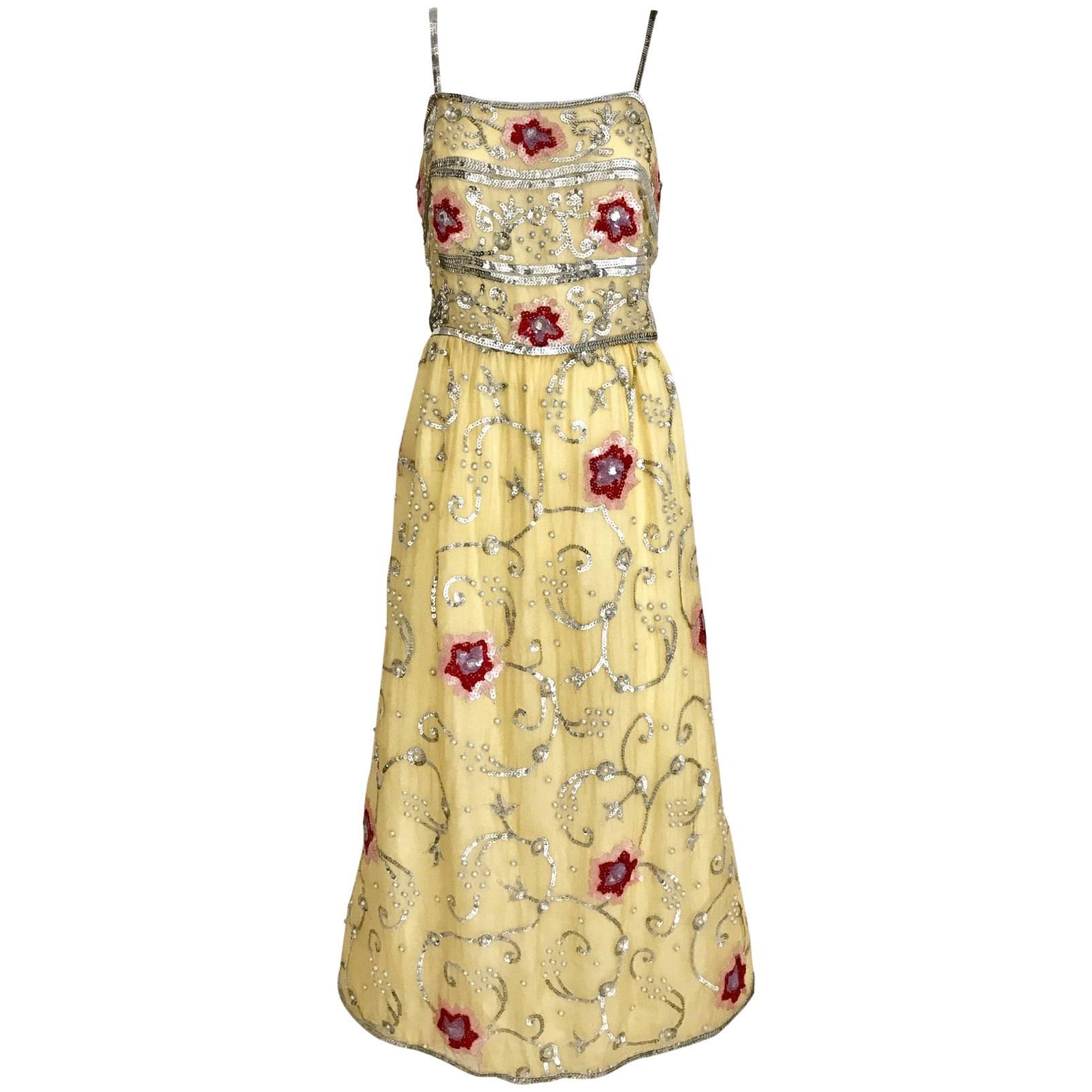 1960s yellow silk gown with red and silver sequin vintage embroidered gown For Sale