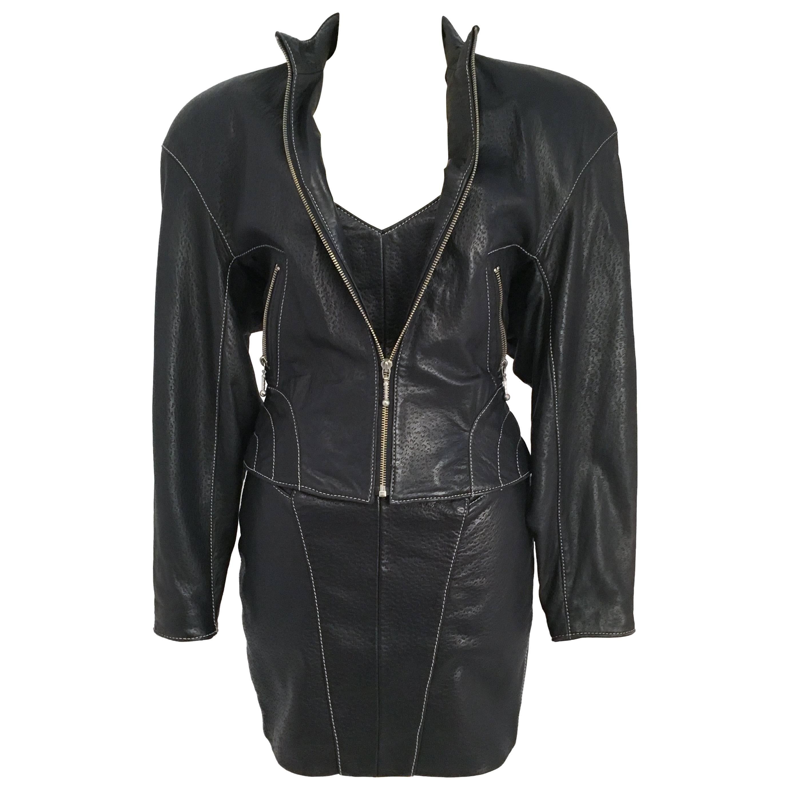 80s Michael Hoban North Beach Leather Black Lamb Skin Dress & Jacket Set. Strapless minidress w/ open back detail, back zip and buckle closure. Contrast white threads on black leather shows off shape of body. High collar jacket with two front