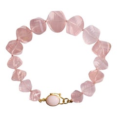 Bracciale in oro giallo 18 carati con opale e quarzo rosa gigante intrecciato