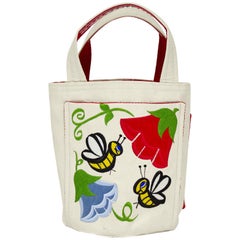 Borsa a secchiello beige degli anni '60 con ricamo floreale