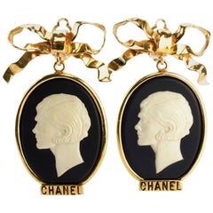 Chanel Gold Plate Bow with Dangle White Statue Clip On Earrings