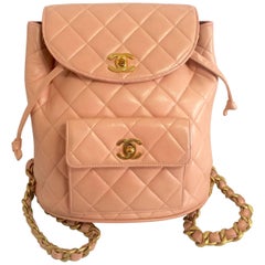 Vintage CHANEL quilted pink lamb leather backpack with golden chains and CC mark 3