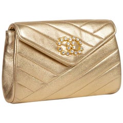 CHANEL Clutch in Gold Quilted Lamb Leather