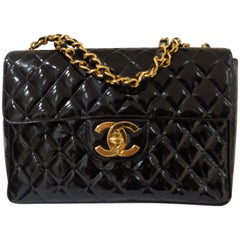 Chanel Black patent leather gold harware maxi jumbo shoulder bag