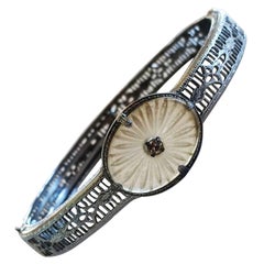 Art Deco Rhodium bracelet set with carved Camphor glass set wth a diamond