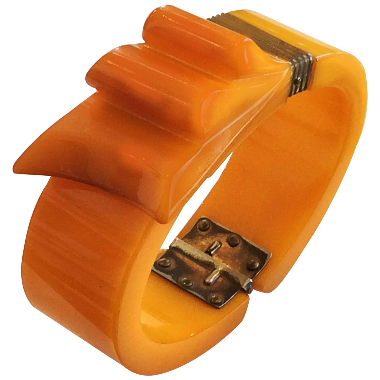 Art Deco Orange Bakelite ribbon clamper or hinged bangle