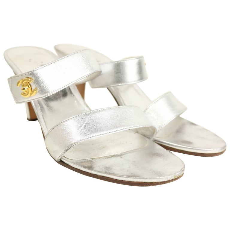 Chanel Silver Metallic Leather Straps Sandals Heels with Gold CC Logo For  Sale at 1stDibs | silver chanel sandals, silver metallic heels, silver  metallic sandals