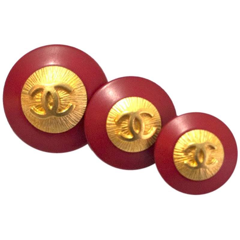 Chanel Set of Three Graduated Red and Goldtone CC Buttons