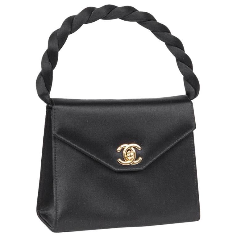 Mini CHANEL Couture Flap Bag in Black Silk Satin.