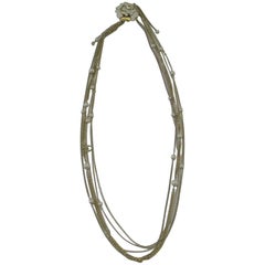 CHANEL Necklace in Gilded Metal, Pearls and White and Golden Camellia 4